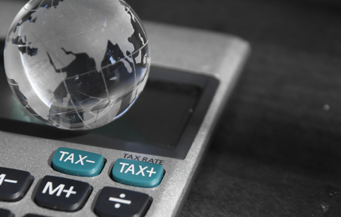 Calculator and globe International statutory and taxes