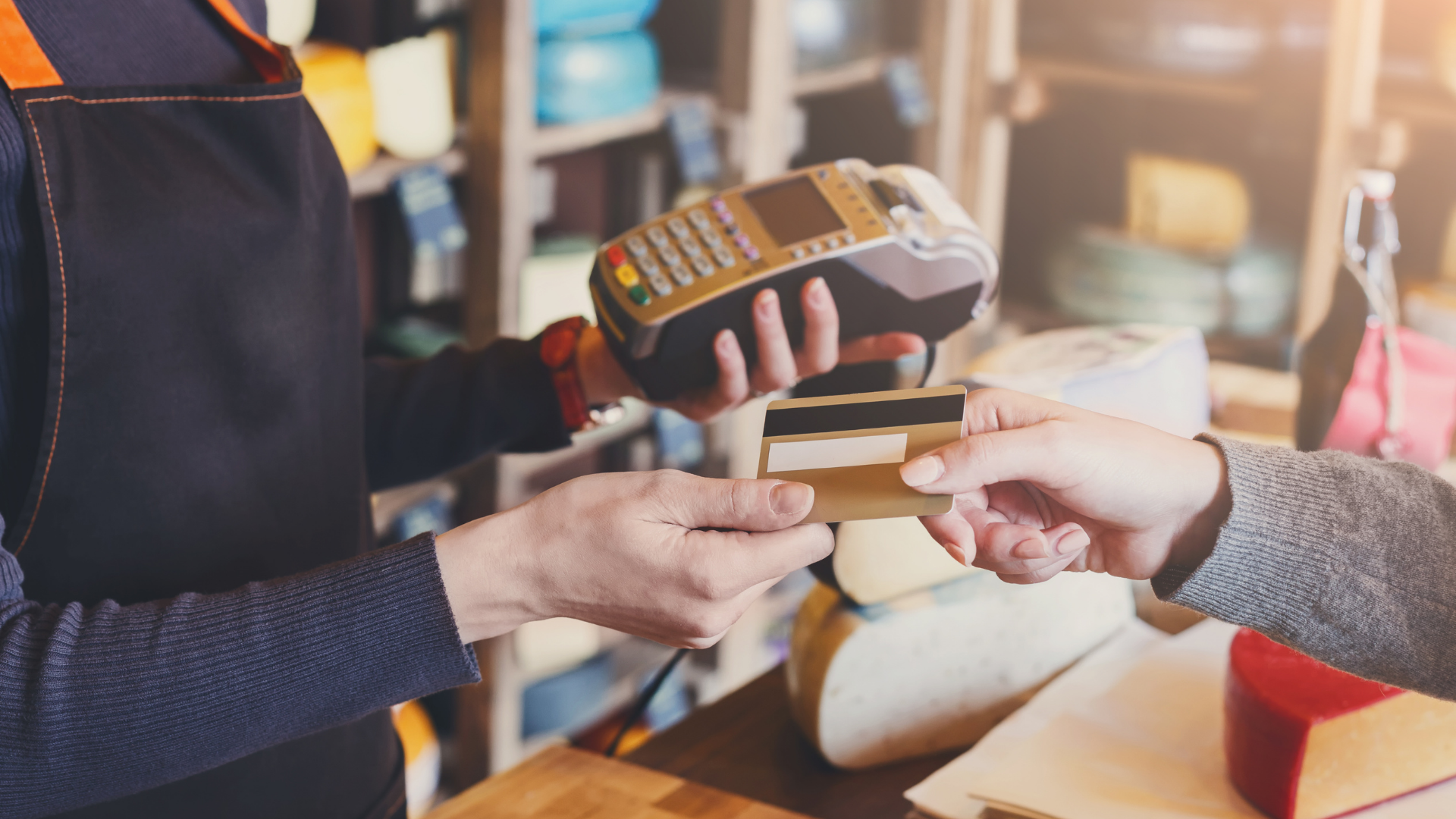 Representative graphic of a customer doing a debit card transaction at a shop