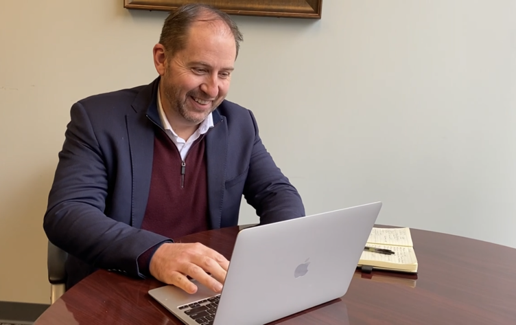 CKH CEO Nico Meyer working on laptop